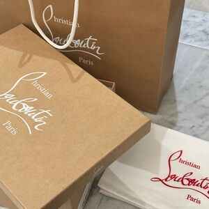 Authentic Christian Louboutin shoe box and dust bag.
